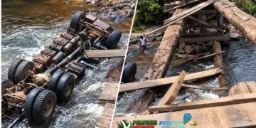 Veículo de carga caiu na água após a estrutura não suportar a passagem. Ocupantes não sofreram ferimentos graves.